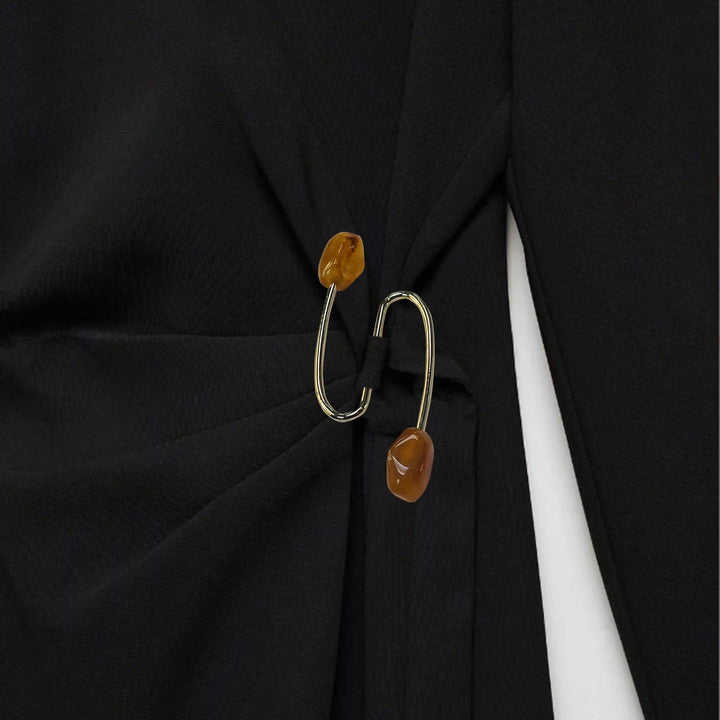Ani Accessories S-Shaped Buckle with Amber Accents Design on a black twisted on waist dress.