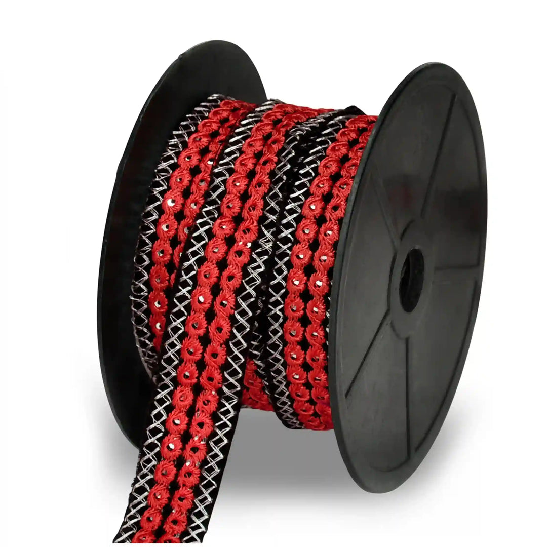 Spool of red and black mirror lace on a white background