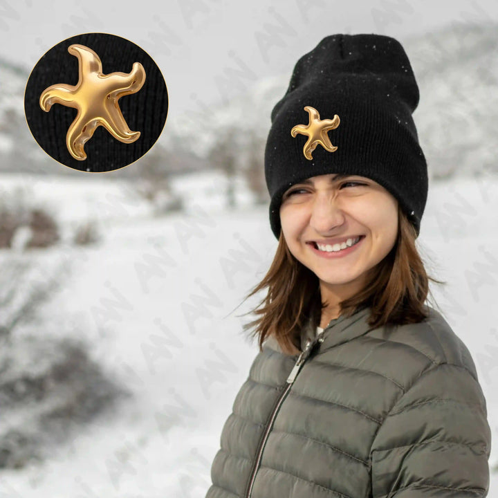 Ani Accessories Gold Starfish Metal Buckle on the black winter cap  in the show background.