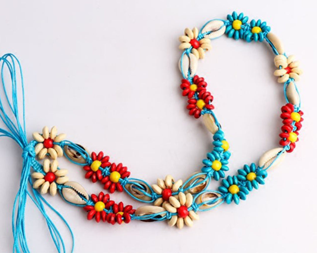 Women’s belt from Ani Accessories with intricate macrame weave, displayed on a white background.
