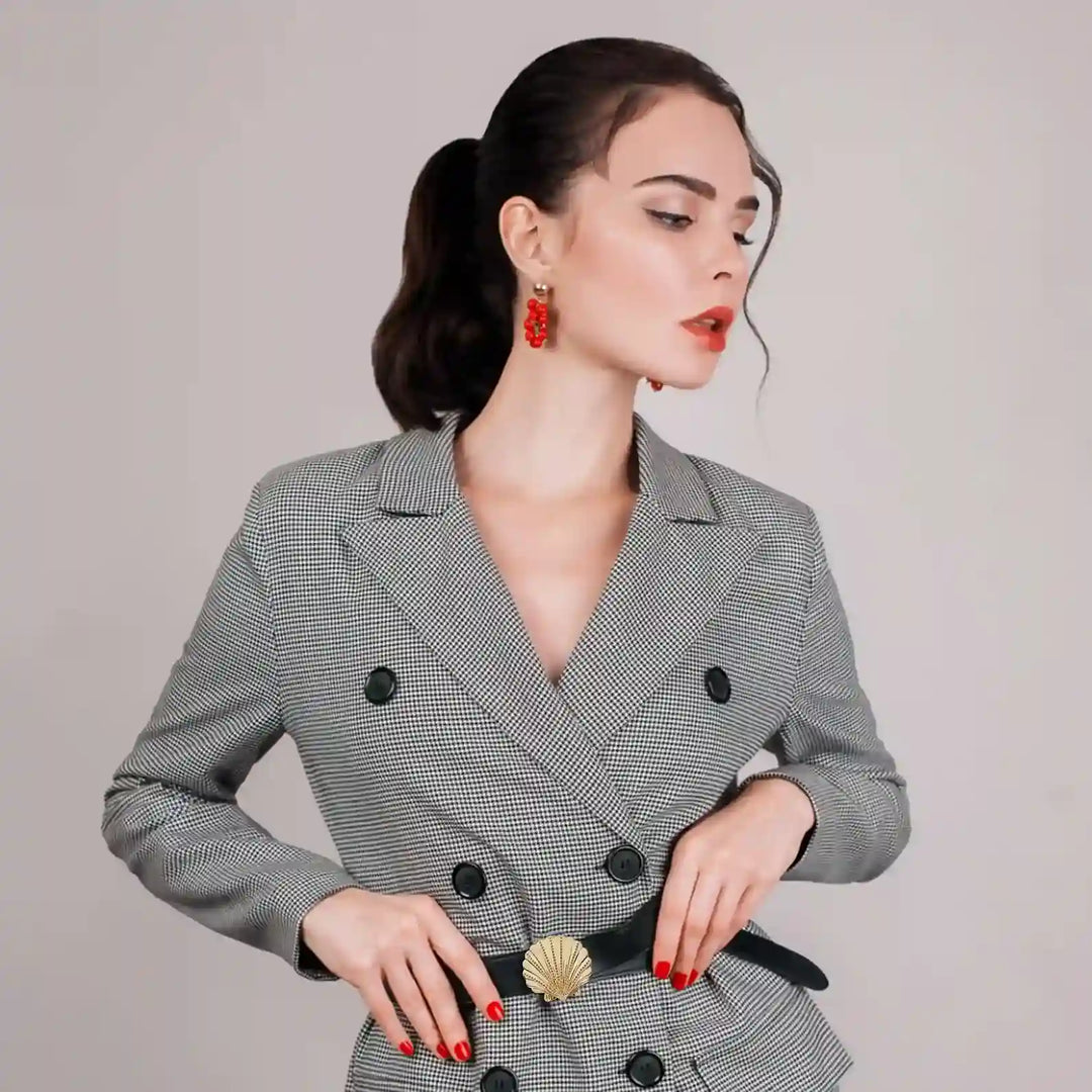 Ani Accessories Scallop Shell Metal Buckle on the black waist belt on the model blazer in the white background.