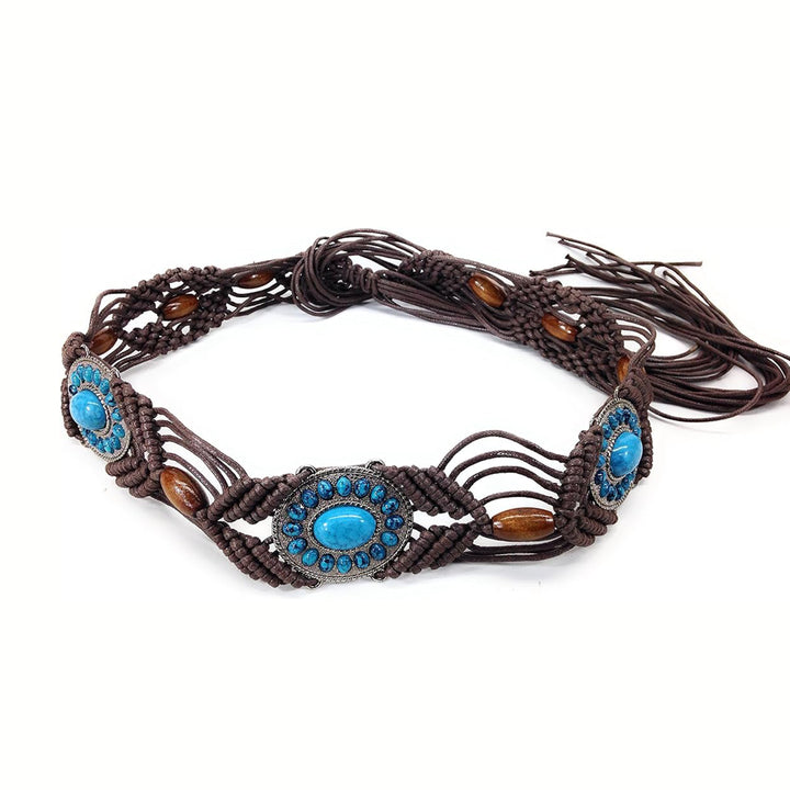 Ani Accessories Womens Belt Studio shot of a statement belt, combining dark brown braided textile and natural elements like wood beads and vibrant faux-turquoise gems in an intricate pattern.