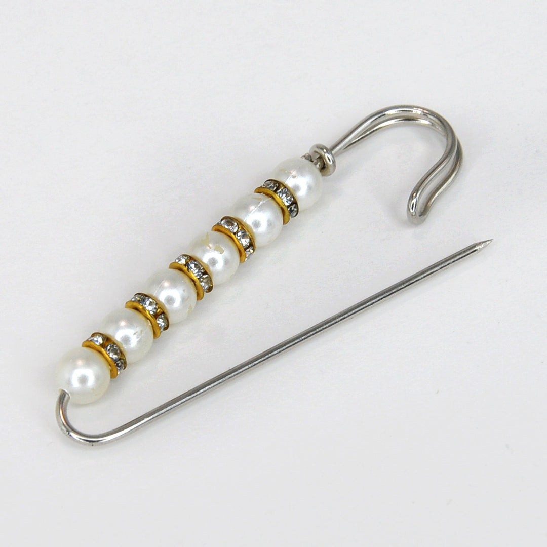Ani Accessories Pearl and crystal brooch with a needle on a white background