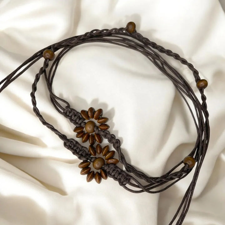 Ani Accessories women’s belt, perfect for styling with dresses, skirts, and jeans.
Daisy dark brown belt on white background.