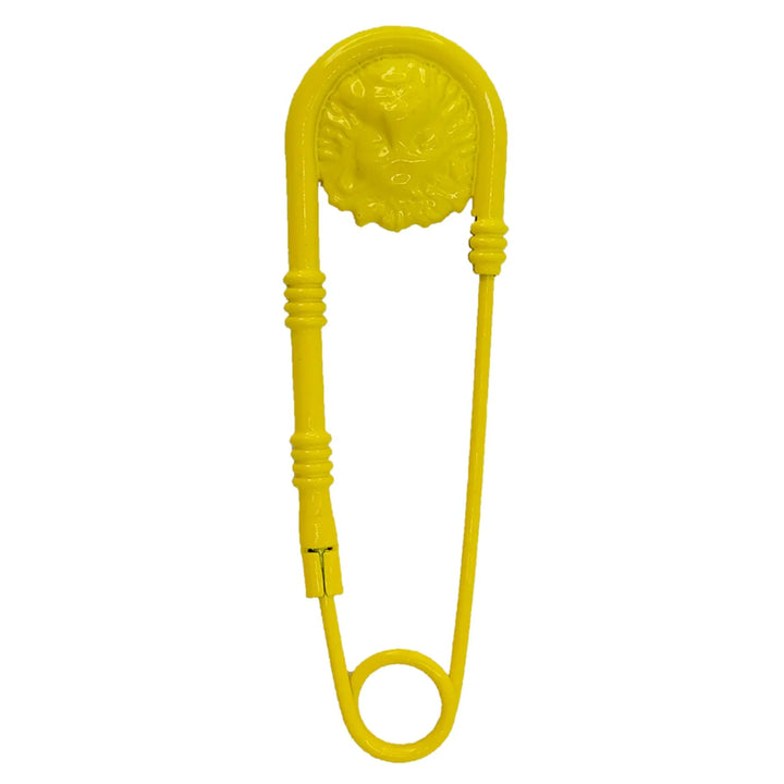 Yellow lion-head safety pin brooch by Ani Accessories, bold fashion accessory for jackets, bags, and outfits.
