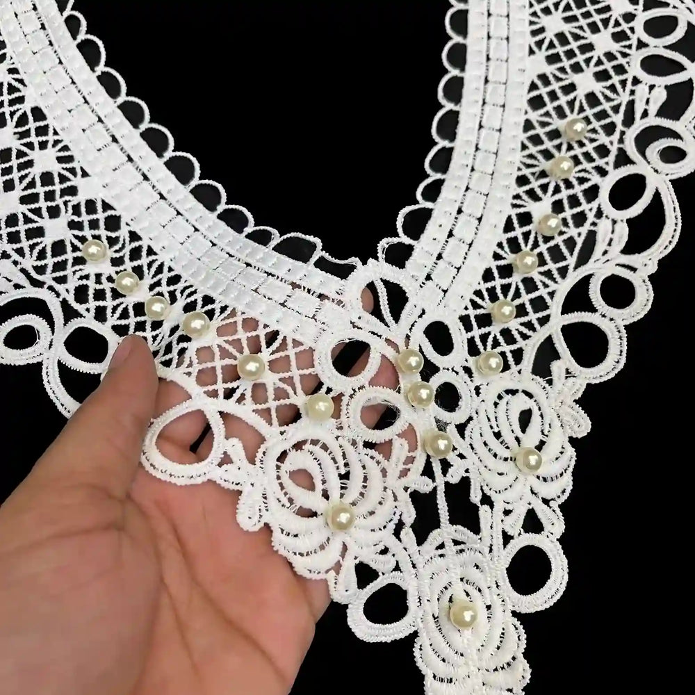 Close-up shoot of cutwork neckline with pearl detailing by Ani Accessories highlighting fine craftsmanship