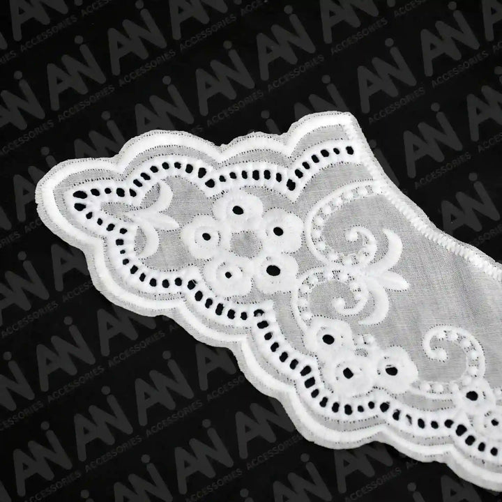 Close up shoot of Broderie Anglaise collar by Ani Accessories featuring classic eyelet embroidery for elegant garment detailing.