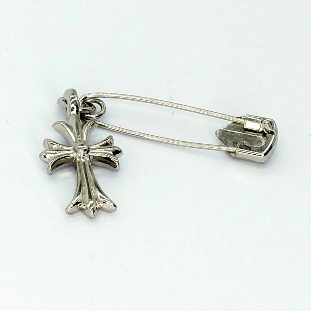 Ani Accessories silver cross-shaped brooch backside image on white, ideal as a stylish safety pin for versatile outfit styling