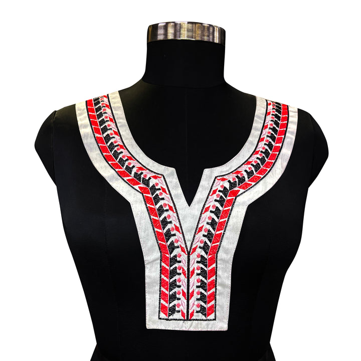 Black and Red Geometric Embroidery on White Fabric Neckline