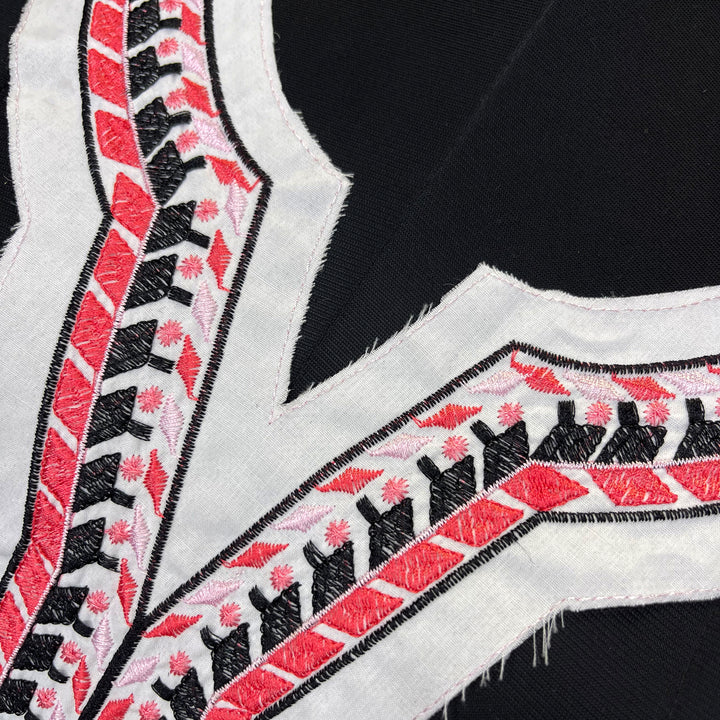 Black and Red Geometric Embroidery on White Fabric Neckline