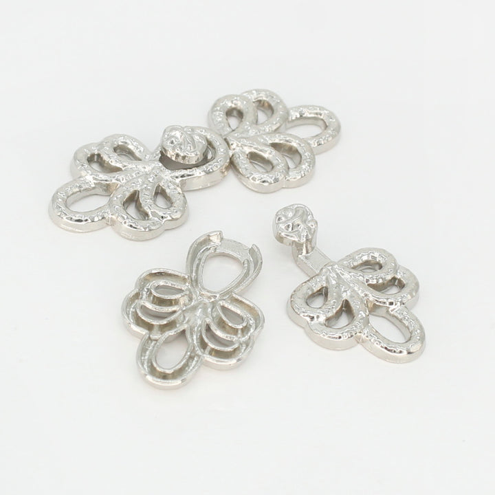 Filigree flourish Frog closure metal button