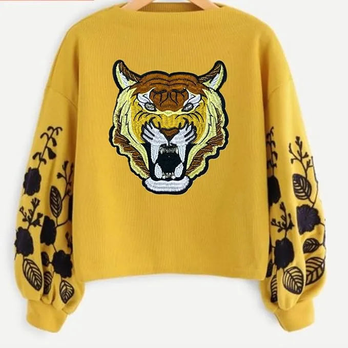 Tiger Patch by Ani Accessories on cloth, embroidered tiger applique styled on fabric