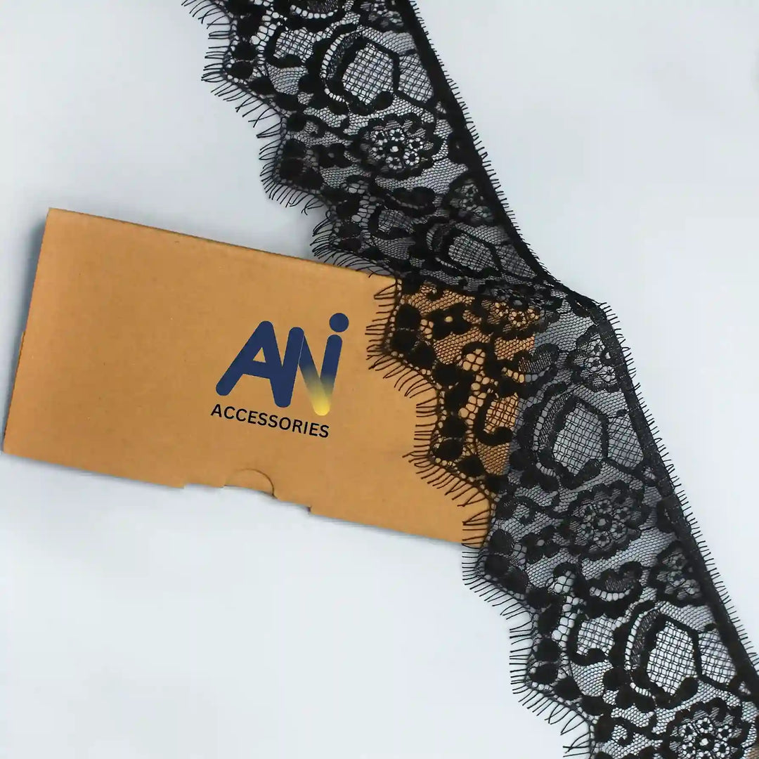 Black Floral Lace Trim Eyelash for Sewing & Crafts by Ani Accessories on a cardboard background