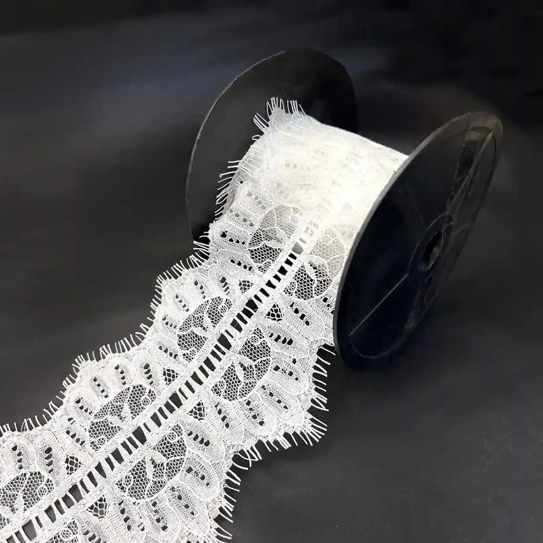 Buy Lace Fabric Premium Soft & Elegant Lace | Ani Accessories on a spool, showcasing its intricate design and texture