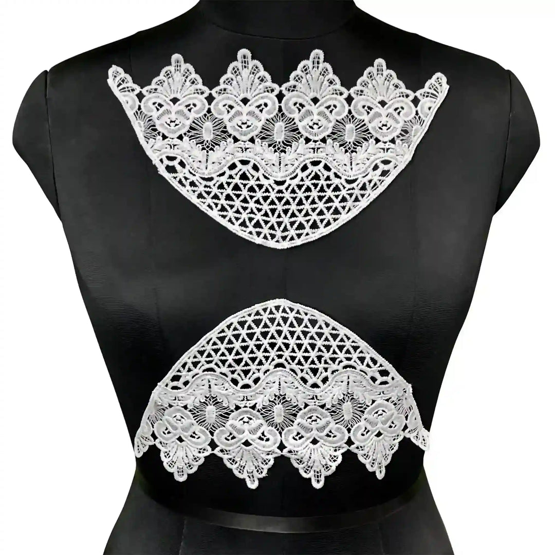 ANI Accessories pair of white half-moon floral applique patches stitched at the neckline and waist of a black mannequin, dyeable patches for dresses
