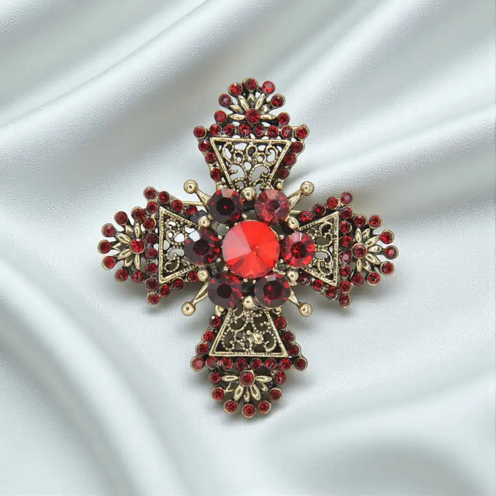 ANI Accessories baroque red crystal filigree cross brooch in antique gold on light satin 