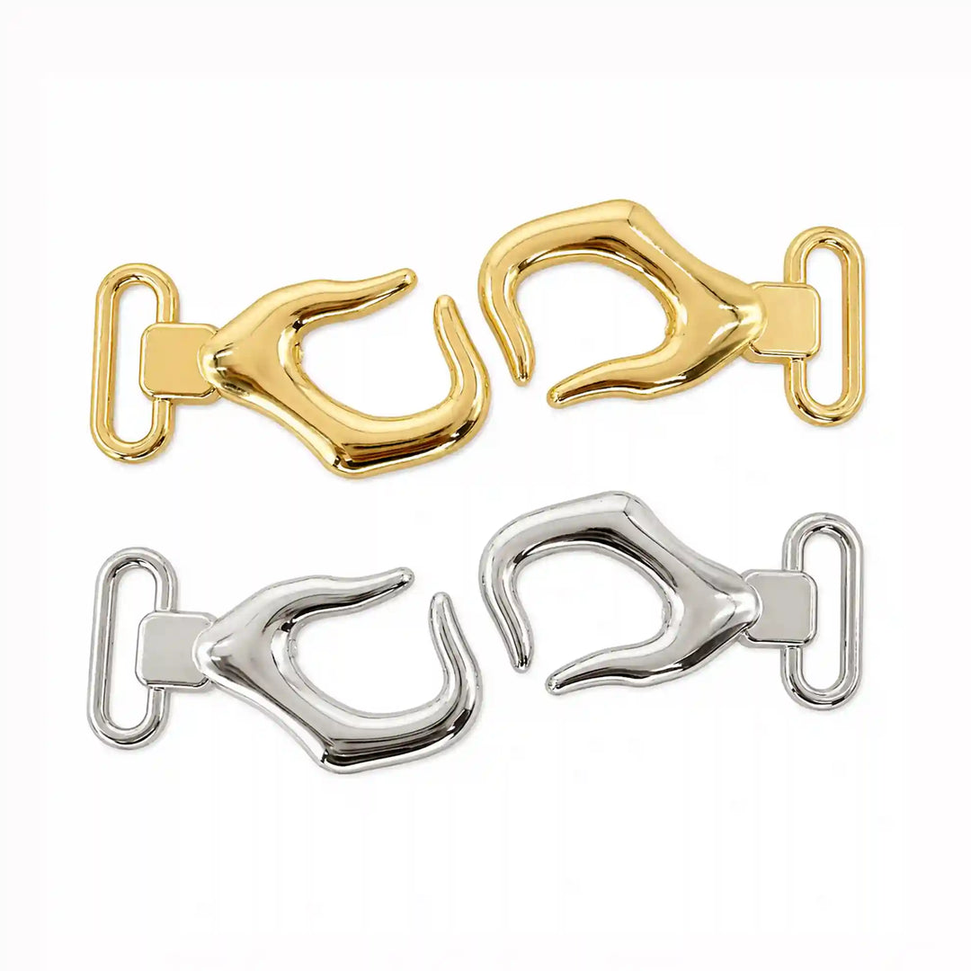 ANI Accessories belt hook buckle shown open, two separate halves in gold and silver with white color Background 