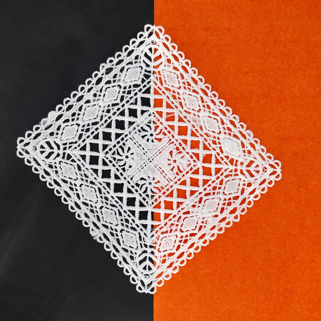 ANI Accessories big white patch for clothes turned on its corner, on a black and orange background 