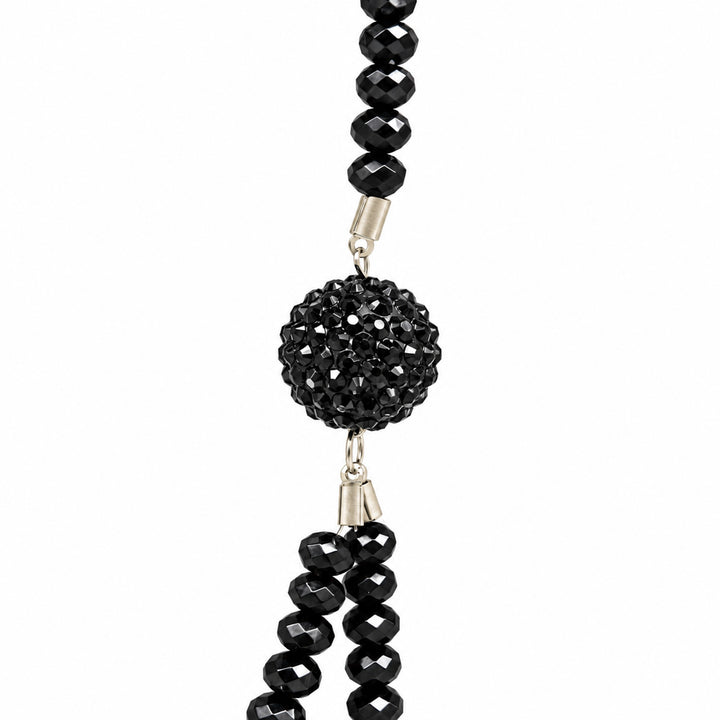 ANI Accessories close-up of textured black ball accent and faceted beads with white color background 