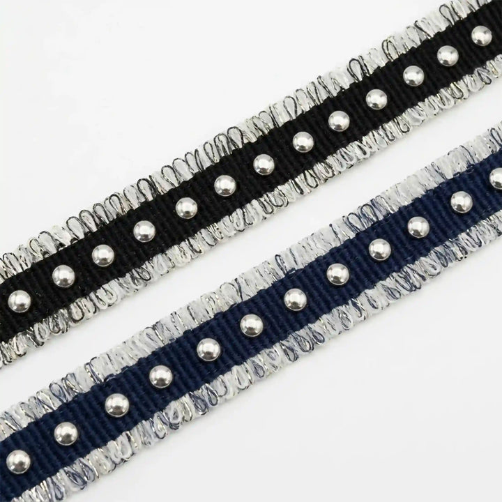 ANI Accessories close-up of black denim fringe trim with silver studs with white color Background 