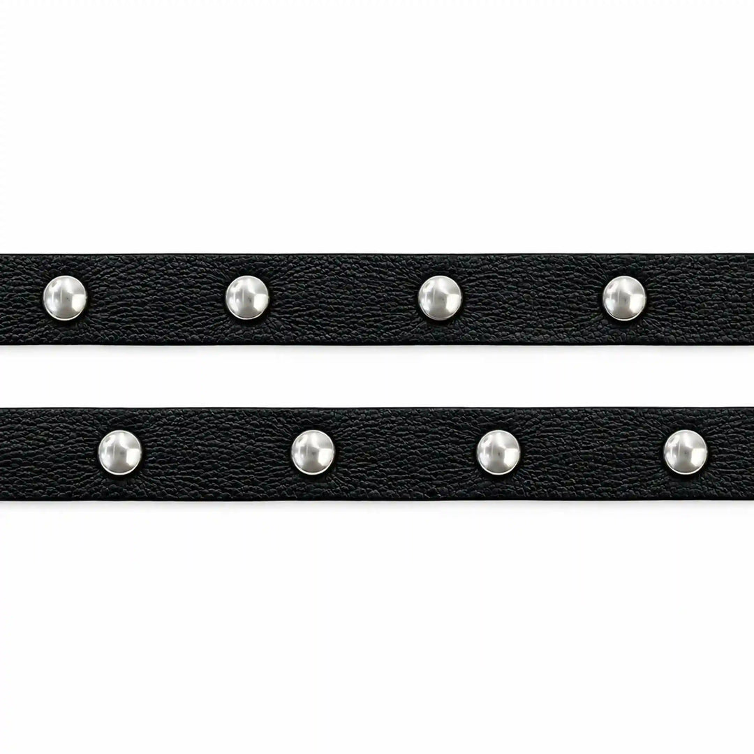 ANI Accessories two black faux leather strips with silver studs laid flat with white color background 