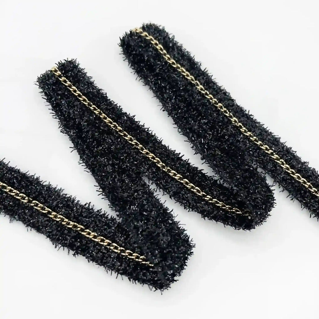 ANI Accessories black glitter lace border folded in a zigzag with white color background 