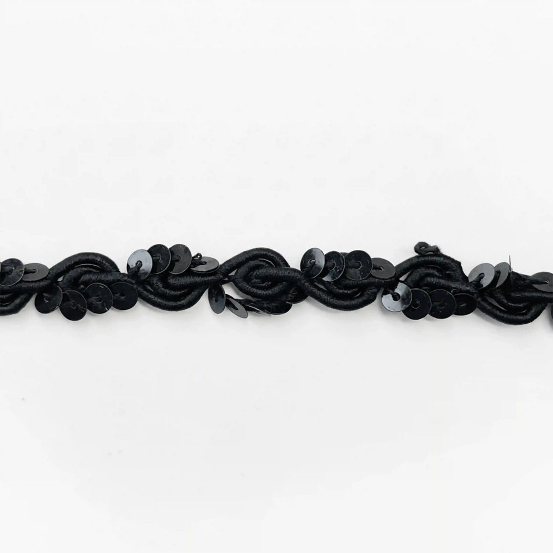ANI Accessories black sequin piping trim laid flat, wavy scroll cord with sequins with white color background 