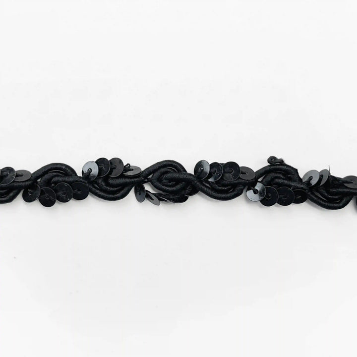 ANI Accessories black sequin piping trim laid flat, wavy scroll cord with sequins with white color background 