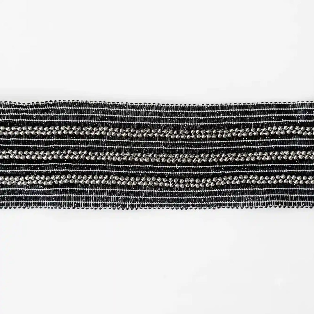 ANI Accessories black and silver beaded trim laid flat on white with white color background 