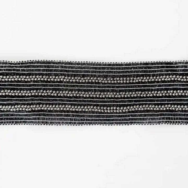 ANI Accessories black and silver beaded trim laid flat on white with white color background 
