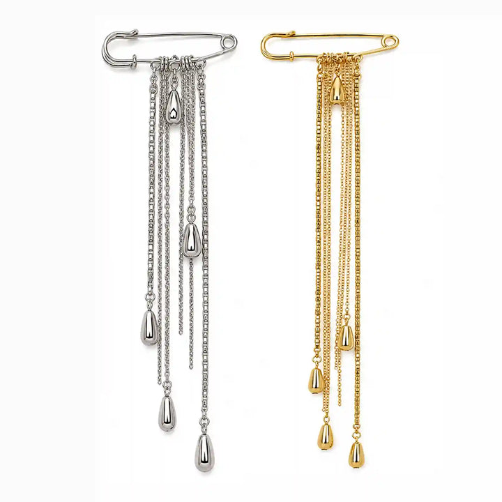 ANI Accessories chain tassel brooch pin in silver and gold with long chains and teardrop drops, on white color background 