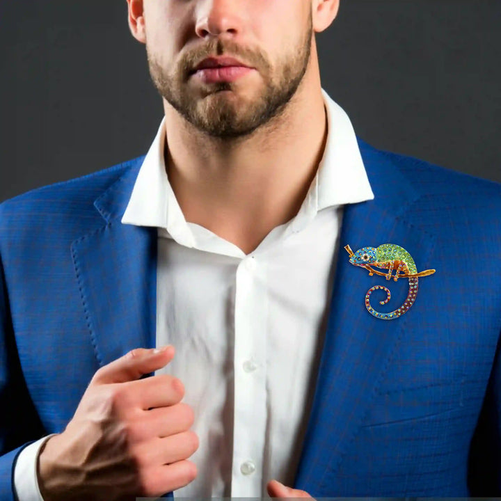 Man wearing a rainbow chameleon brooch on a blue blazer lapel