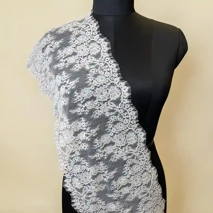 ANI Accessories white Chantilly lace for suits draped on a mannequin 
