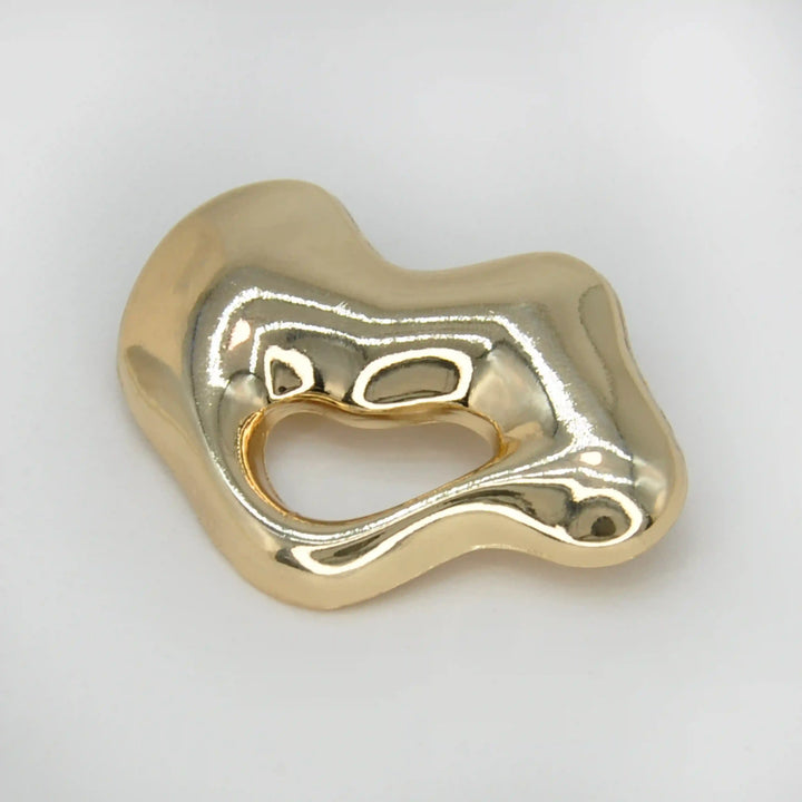 ANI Accessories lips inspired metal brooch, chunky gold lips with an open mouth, on grey with white color background 