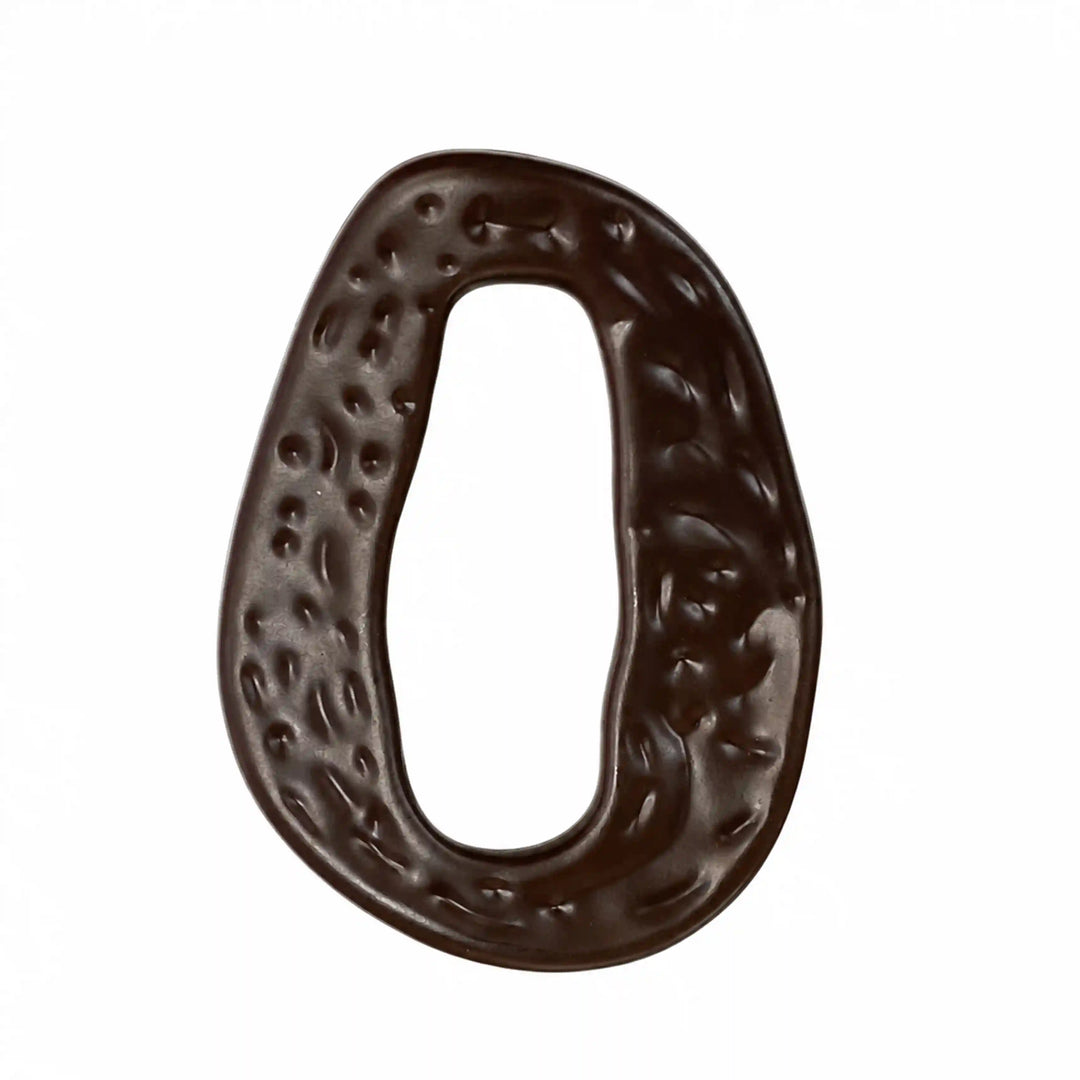 ANI Accessories dark brown hammered oval ring buckle lying flat, front view of the textured surface on white color background 