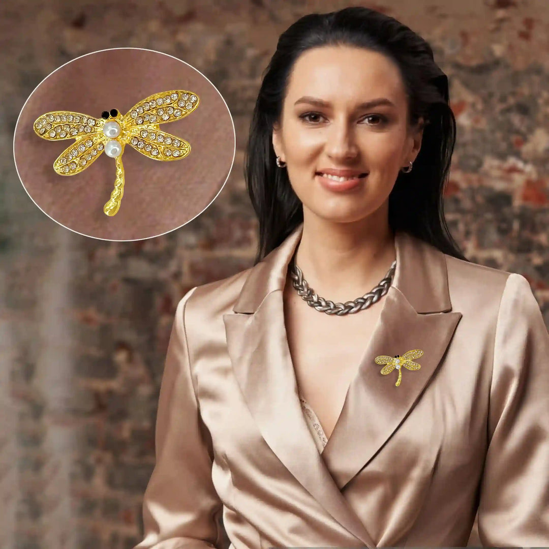 Gold dragonfly pearl brooch adorned with shimmering gems, perfect for elegant outfits