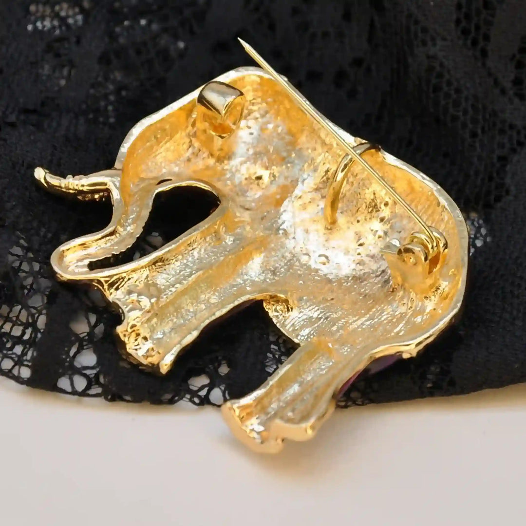 Back side of the elephant brooch in gold-tone metal with brooch pin 