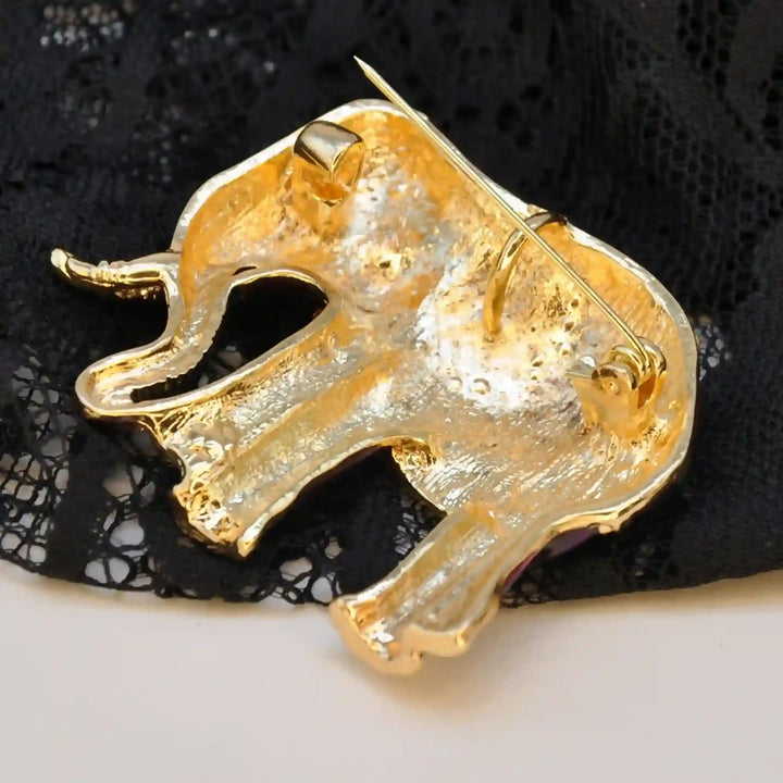 Back side of the elephant brooch in gold-tone metal with brooch pin 