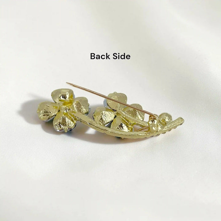 ANI Accessories emerald clover brooch back side showing the pin 