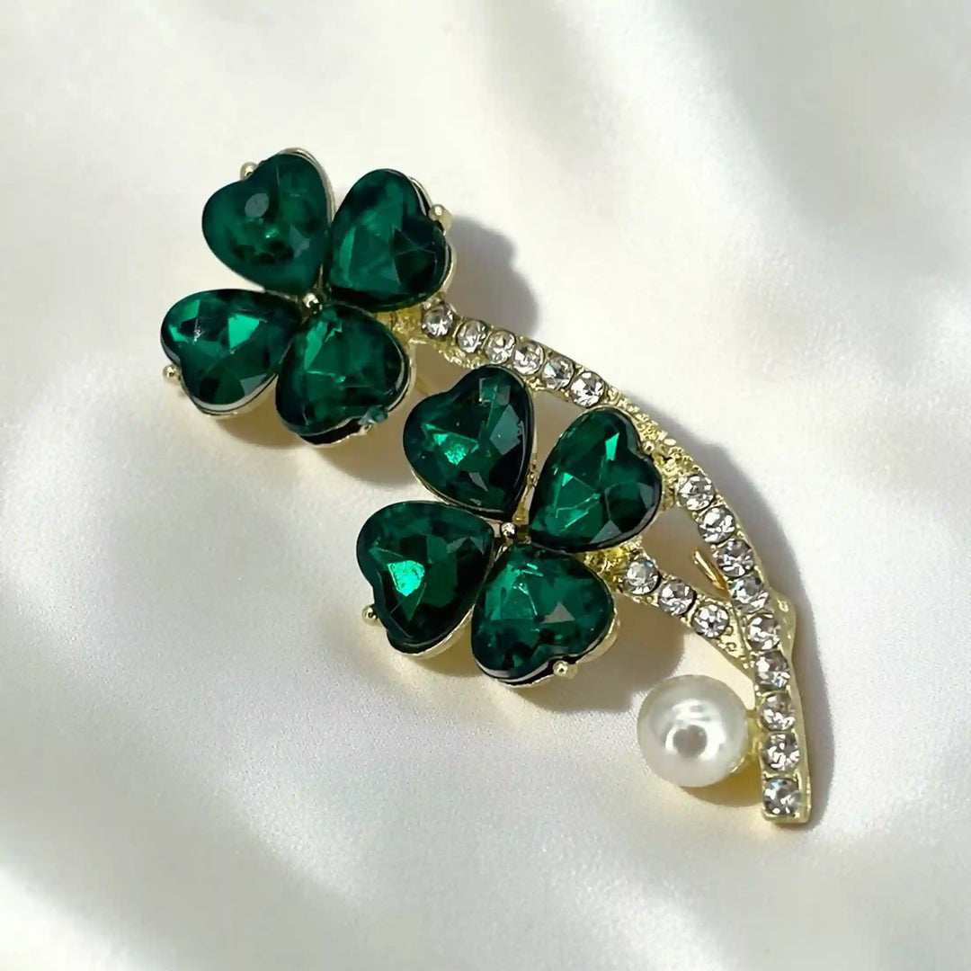 ANI Accessories emerald brooch for women with green crystal clovers, rhinestone gold stem and pearl on white satin 