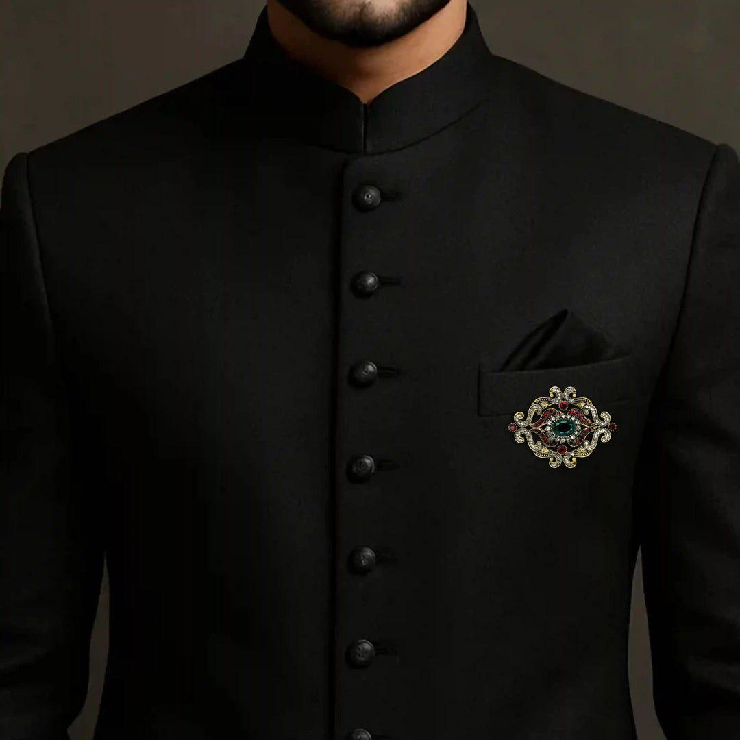 ANI Accessories emerald green brooch on the chest of a black jodhpuri suit 