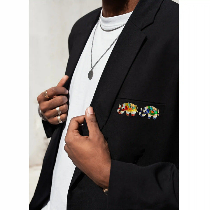 ANI Accessories enamel elephant brooch pinned on a man's black blazer lapel 