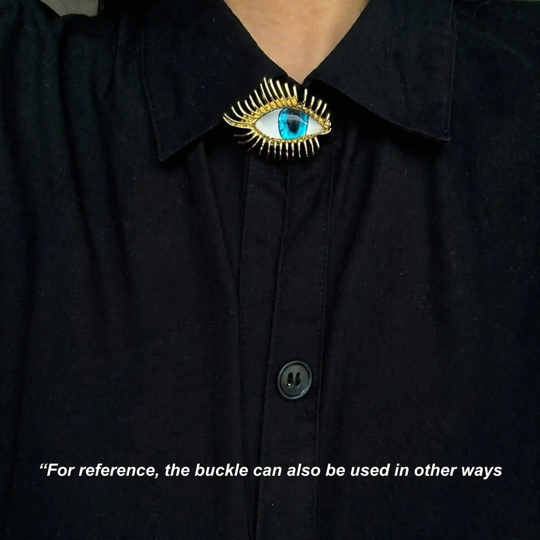 ANI Accessories evil eye pin brooch worn at the collar of a black shirt 
