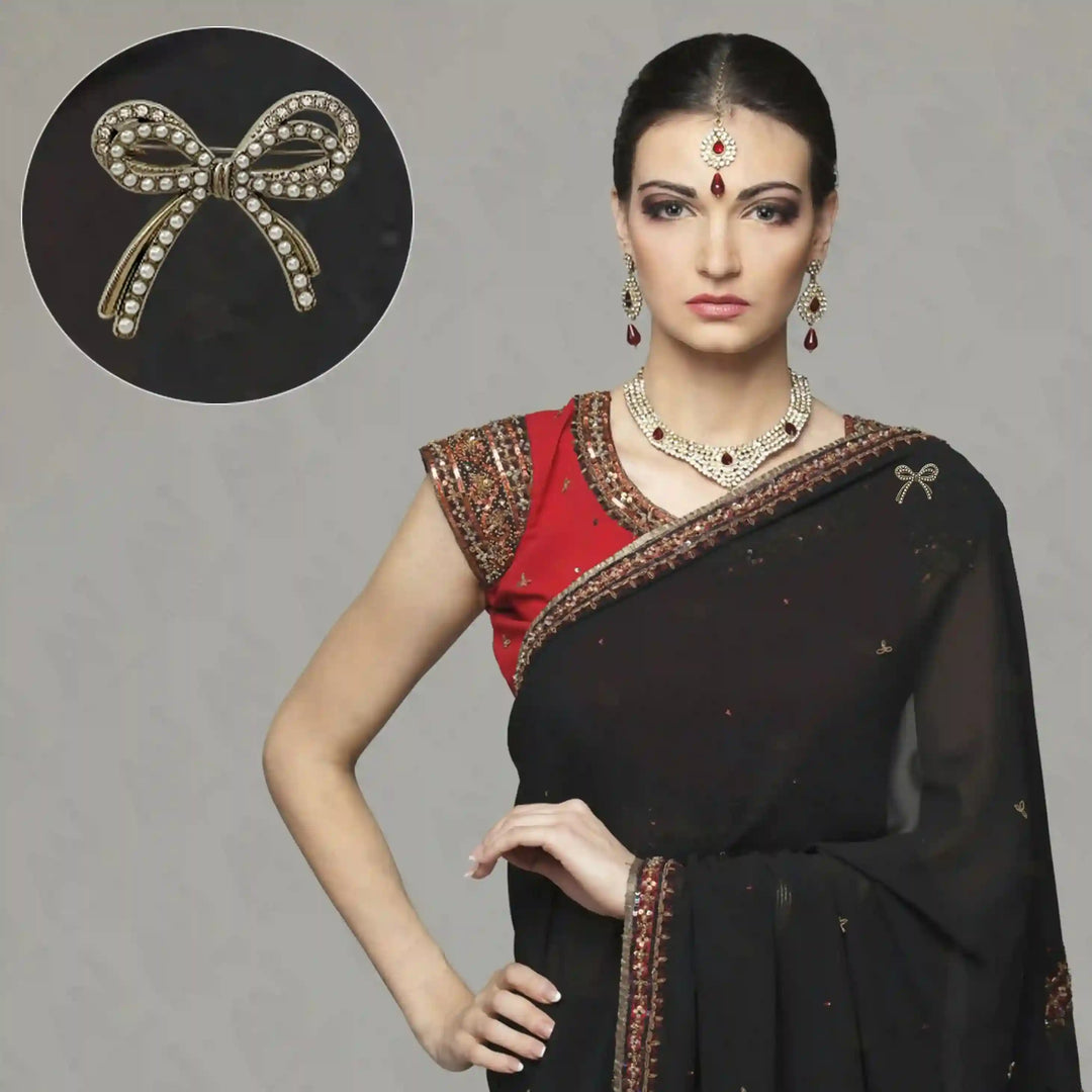 Elegant Bow Pearl Rhinestone Brooch for Women's Fashion showcased on a traditional black saree