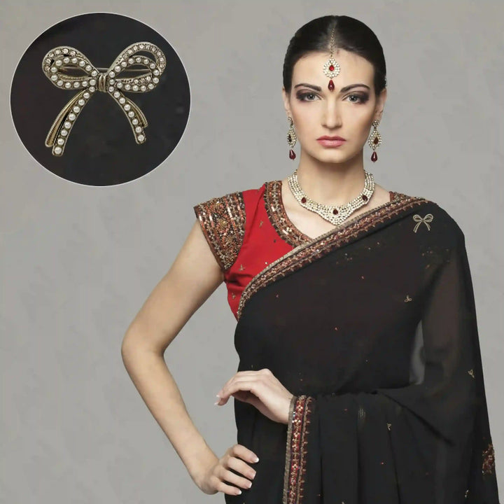 Elegant Bow Pearl Rhinestone Brooch for Women's Fashion showcased on a traditional black saree