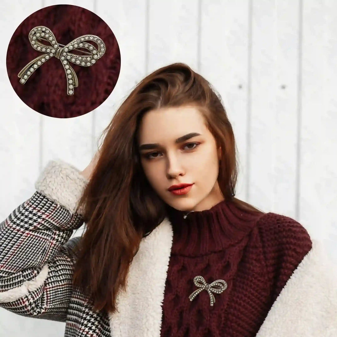 Bow Pearl Rhinestone Brooch for Women's Fashion displayed on a cozy sweater, adding elegance and style