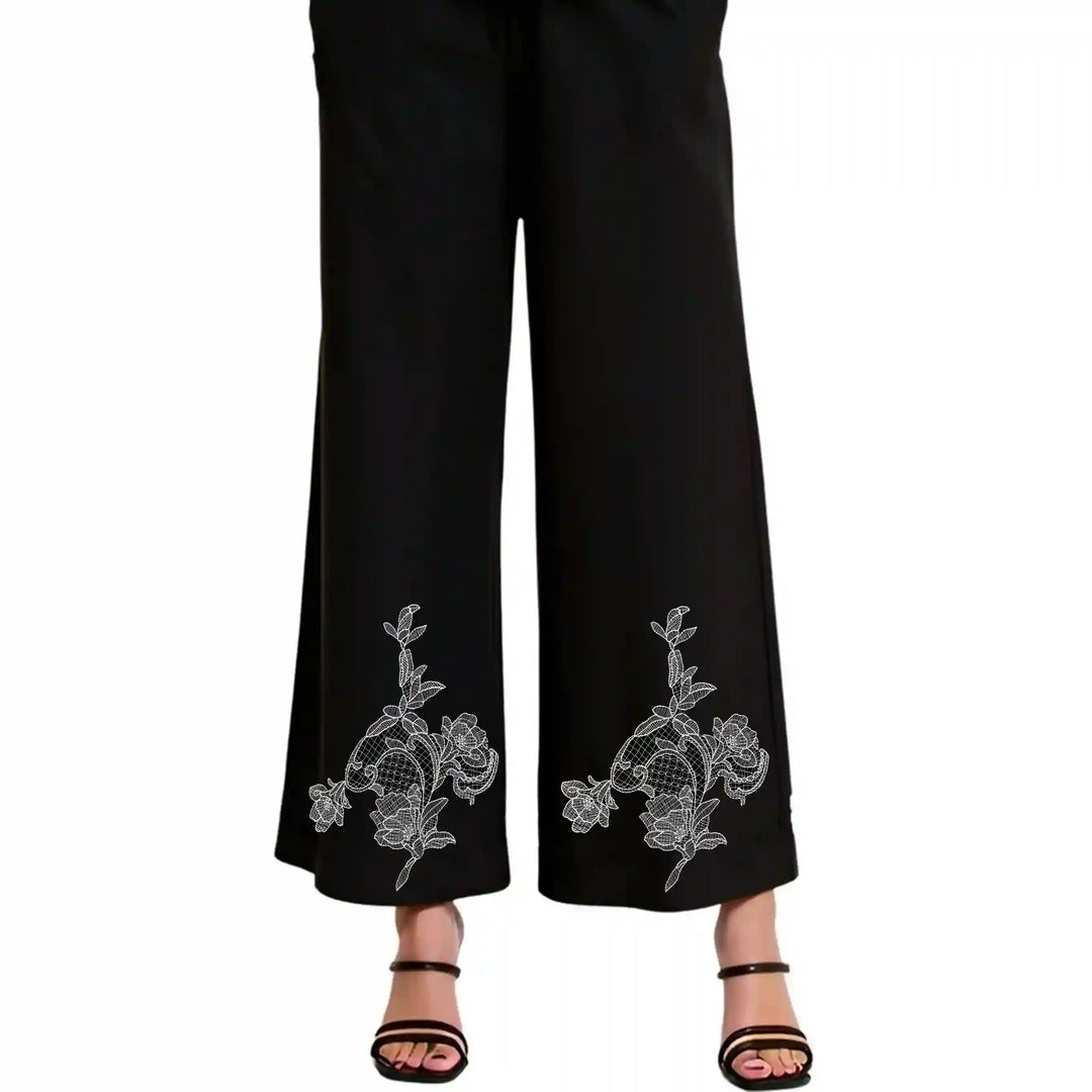 ANI Accessories flower patch design stitched near the hem on both legs of black trousers 