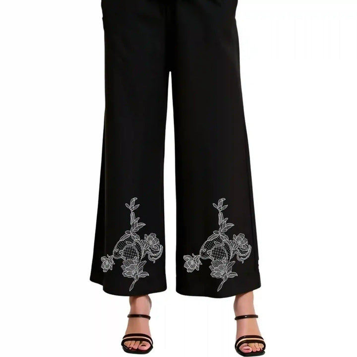 ANI Accessories flower patch design stitched near the hem on both legs of black trousers 