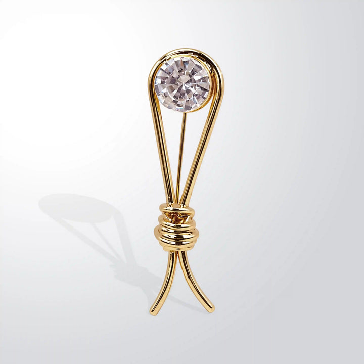 ANI Accessories gold collar brooch with a clear faceted crystal, front angle view with white color background 