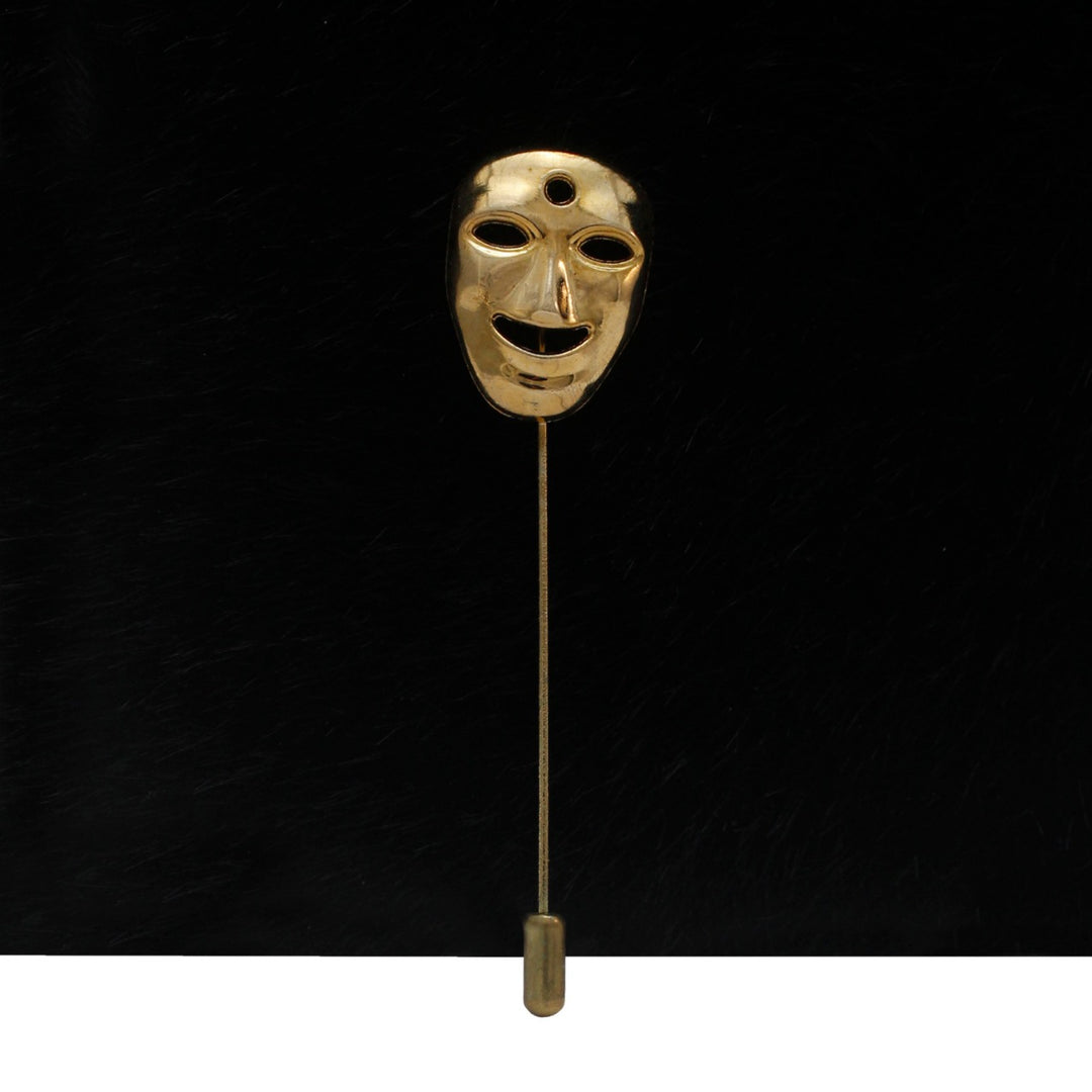 Gold mask lapel pin by Ani Accessories featuring a unique mask design for stylish accessories
